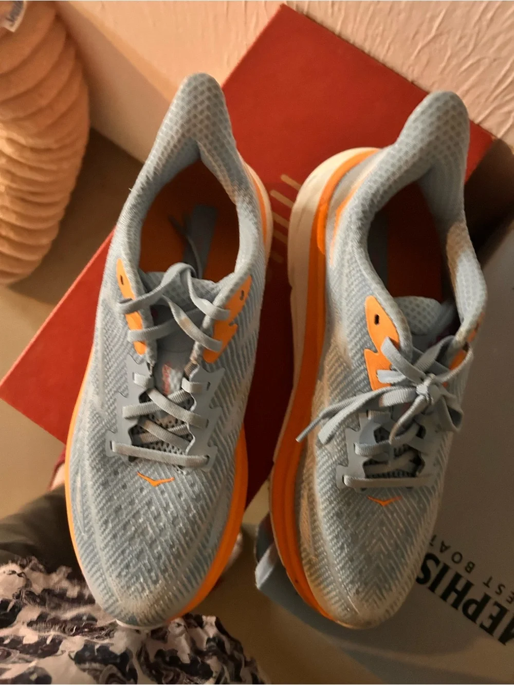 Hoka women Running Sneaker in Light Blue with Orange Accents 9.5D wide